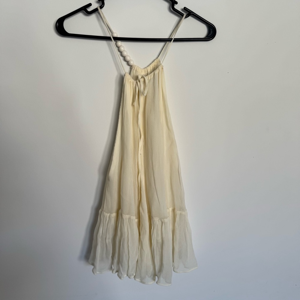 Womens Cream Ruffle Hem Tank Top